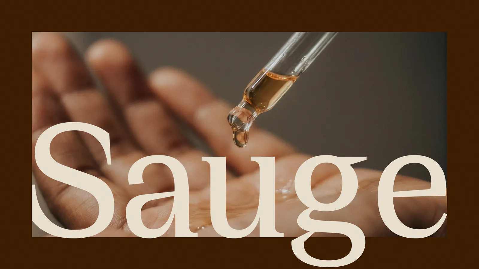 Sauge wordmark in cream over a hand holding a dropper of serum, on dark brown