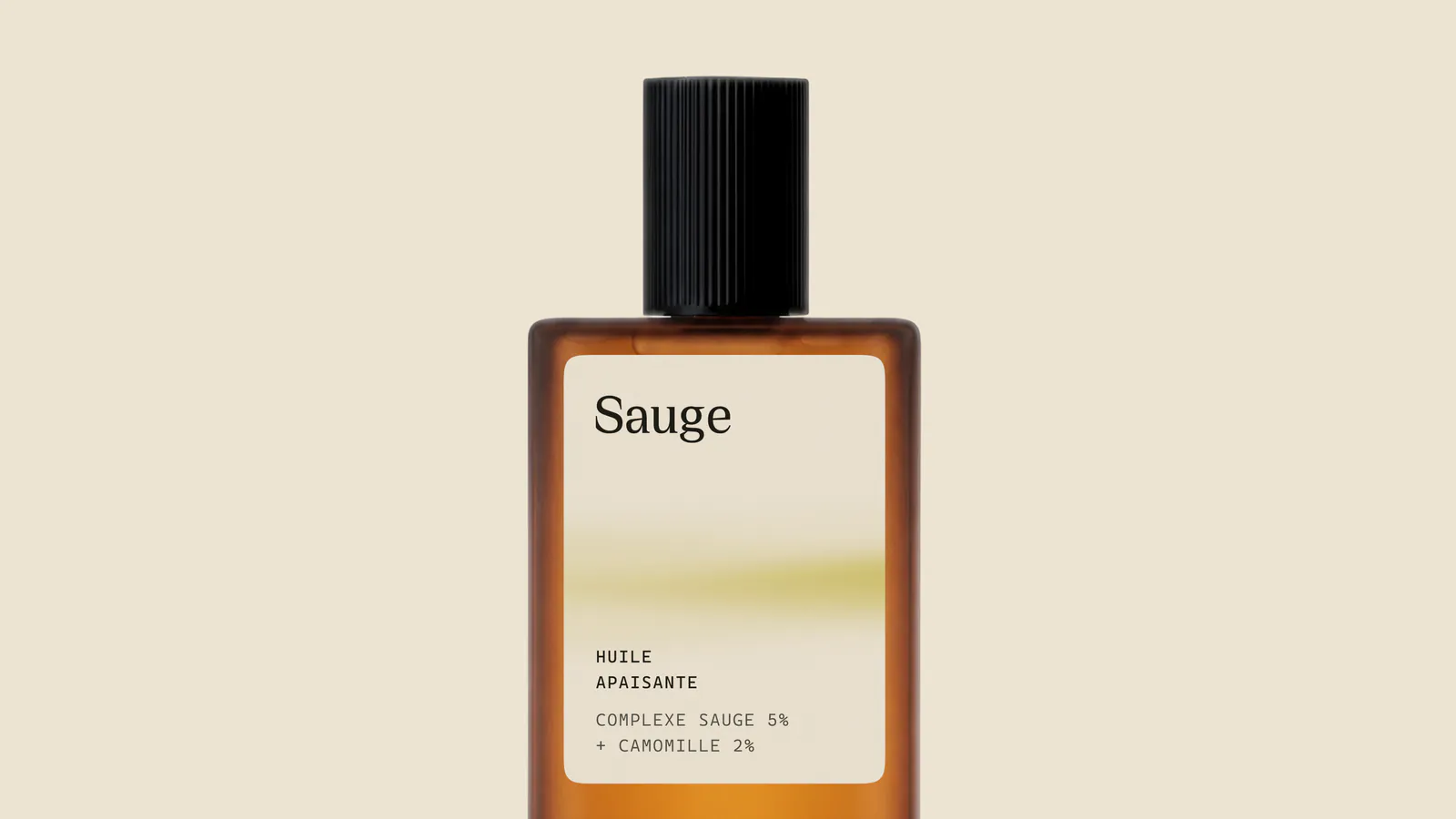 Close view of the amber Sauge bottle with the Huile Apaisante label